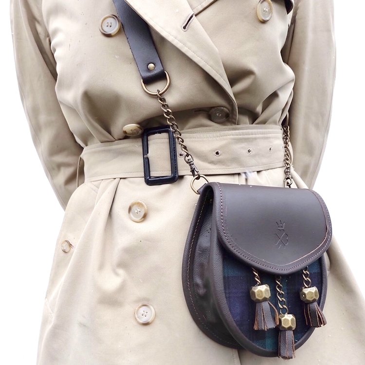 Nixey Blackwatch Sporran Handbag in Brown Leather with Bronze Fittings on model as cross-body bag