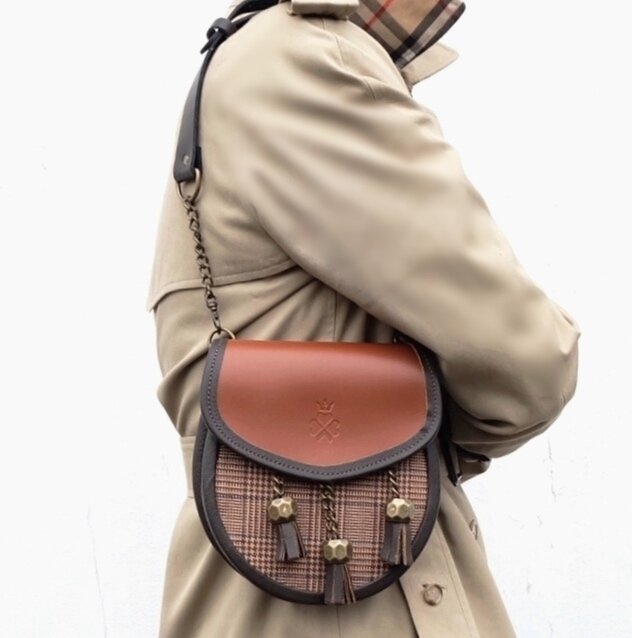 Nixey Glen Keith Tweed Sporran Handbag in Chestnut Leather with Bronze Fittings on model as shoulder bag