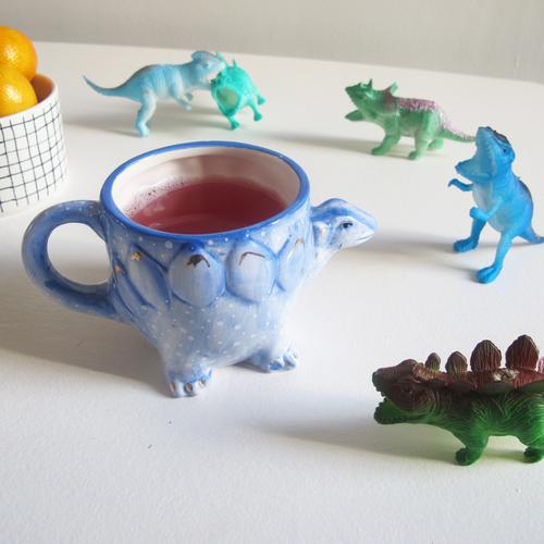 Stegosaurus Shaped Ceramic Cup in use