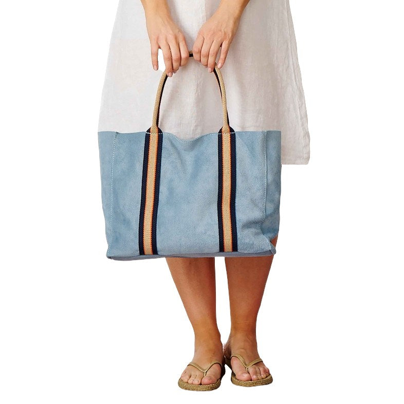 Summer Suede Tote Bag Sky Blue held by model